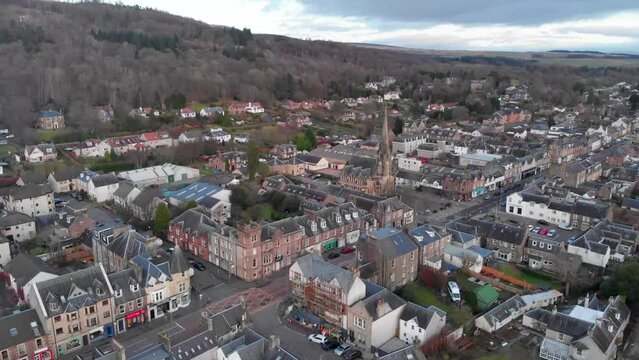 Drone footage. Slowly ascending over the town of Callander, Scotland, Highlands