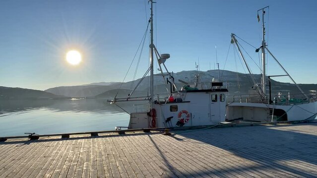 View of a Fishing boat at Fauske Pier, Northern Scandinavia, Norway, bright sunny day.