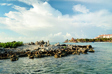 Mexico, Caribbean sea, view resort Mayan riviera. Beach, coral reefs, rocky coast. Rest and relaxation in the Caribbean. Beautiful background, landscape of the Caribbean. Puerto Aventuras