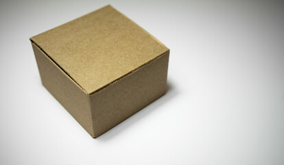 Brown cardboard box on white isolate. Craft box without inscriptions.