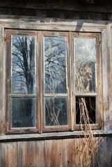 The window of an old,wooden farmhouse , abandoned