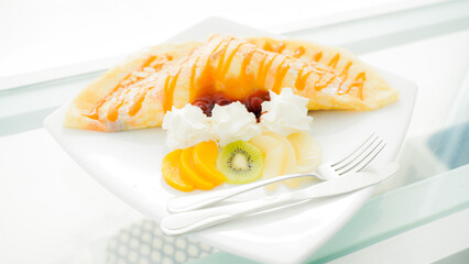 Cake decorated with fresh  on white background. Cafes in Phuket Thailand.