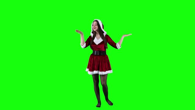 Female model Christmas costume acts like the snow if falling and blows it to the camera