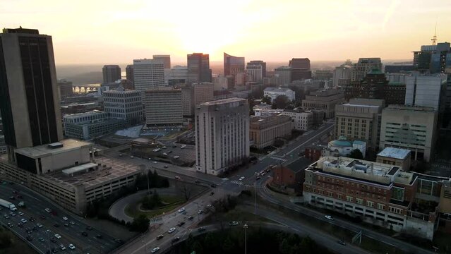 Downtown, Broad Street, and I-95 at Sunset in Richmond, Virginia (USA) | Aerial Circling View | Winter 2022