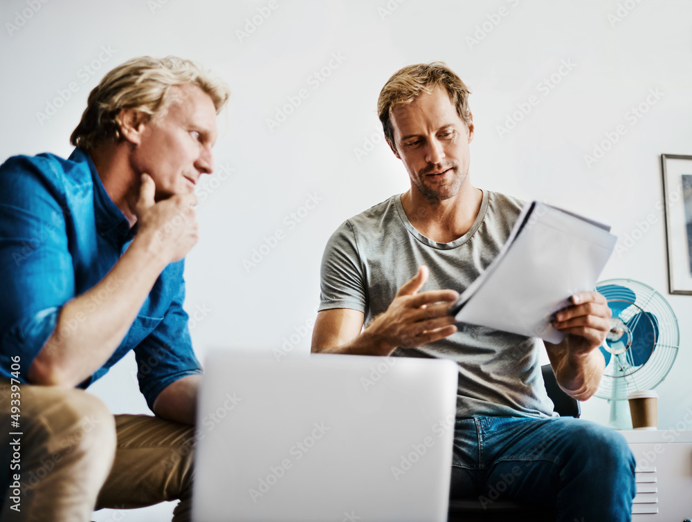 Poster analysing their plans carefully before taking action. shot of two designers brainstorming together i