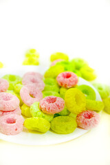 Bowl of colorful fruit loops . Multigrain cereals in a form of rings, close-up, food background