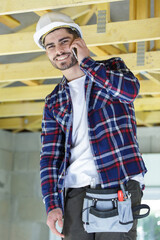 male construction worker builder on cell phone