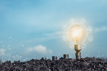The idea of supporting, promoting and expanding people to use natural energy. with overlapping coins Empty rows with light bulbs in a blue sky background with white clouds.