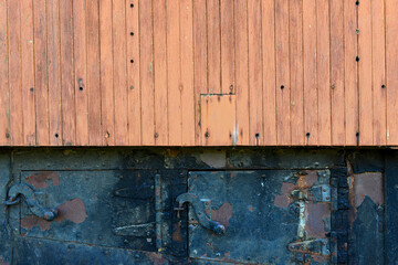 Detail of wood siding over cast iron on an antique railroad car