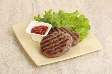Grilled beef burger cutlet with sauce