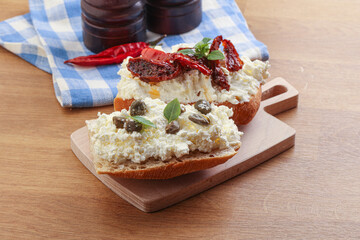 bruschetta with soft cheese capers and tomato