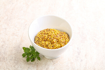 Grain mustard sauce in the bowl