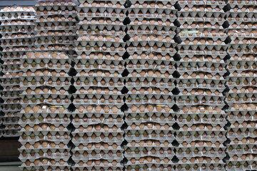 Egg cartons stacked on grocery warehouse