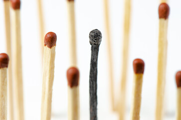 Burnt matches on a white background. The concept of burnout syndrome at work. Macrophotography