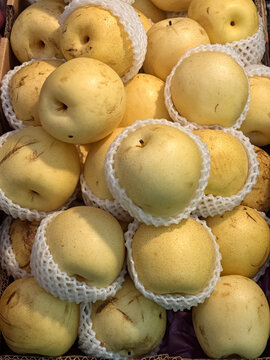 Closeup of fresh Asian Pear (Naschi Birnen or Nashi Pear) for sale at a food market  