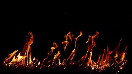 Haystack fires at night in arid areas The ash erupted and the wind was very dangerous. ashes red as hell.