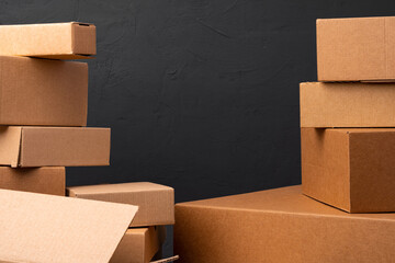 Stack of cardboard boxes against black background