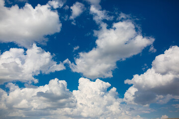 Naklejka na ściany i meble Beautiful clouds against the blue sky.