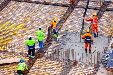 Concrete pouring on the construction site.