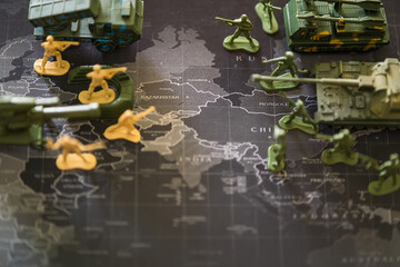 Bangkok, Thailand - March, 16, 2022 : Green toy soldier doll They are waging war on the world map. Russian War of Ukraine War Concept