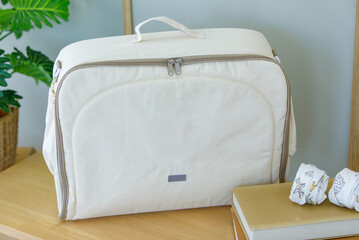 Closeup studio shot of cream and beige color large multifunction multipurpose utility newborn baby...