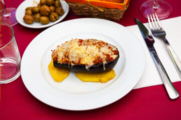 Flavorful grilled eggplant stuffed with mix of spiced rice, artichoke and cheese served with slices...