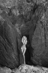 Blonde surrounded by huge rocks