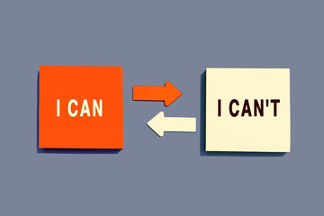 Note paper with arrows between the options of I Can or I Can't on grey background, top view. Motivation Concept