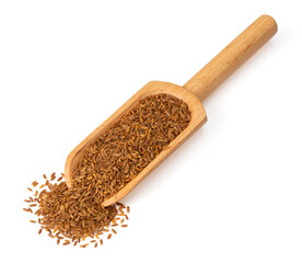 Roasted cumin seeds in the wooden scoop, isolated on the white background.