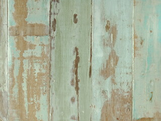Texture of old vintage wood with peeling paint , light green color background .