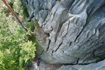Aerial view of large rocky formations with snone boulders and mountain high cliffs
