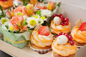 Cupcakes with cream and fresh berries