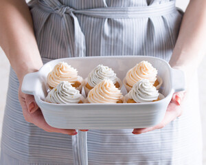 Vanilla cupcakes with pastel colored cream
