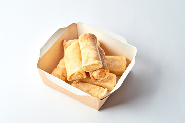 Frozen crepes in cardboard on a gray background