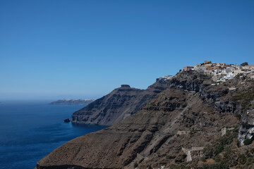 View of Fira and the picturesque village of Oia in the background in Santorini Greece