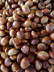 Fototapeta premium Chestnuts on a farmers market stall in the Aegean coastal town Bodrum, Turkey. 
