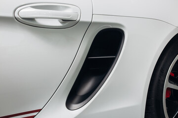 The air intake of a sports car on the fender