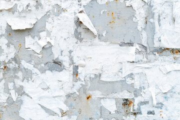 Rough metal surface with pieces of paper. Abstract background. Old information board.