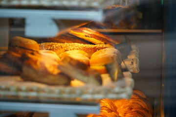 Tasty French pastry in a patisserie sweets shop from Paris. Quiches, croissants and other specific breakfast foods of France. photo inside.