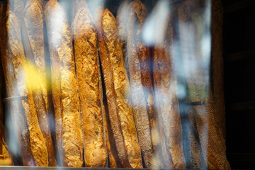 Tasty French pastry in a patisserie sweets shop from Paris. Quiches, croissants and other specific breakfast foods of France. photo inside.