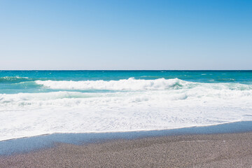 Fototapeta na wymiar beautiful beach with sand, turquoise sea with waves