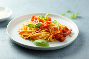 Spaghetti with tomato sauce and basil