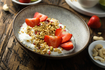 Granola with yogurt and fresh strawberry