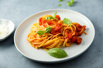 Spaghetti with tomato sauce and basil