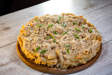 cheese and pasta cake with herbs