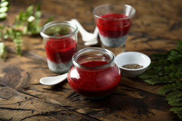 Panna cotta or chia pudding with red berry sauce