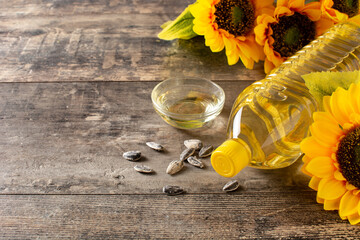 Sunflower oil plastic bottle on wooden table. Copy space