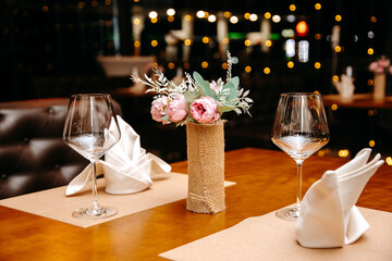 wedding glasses on table, Table in the restaurant in the open air with glasses of wine and serving., Table setting for romantic dinner in restaurant.