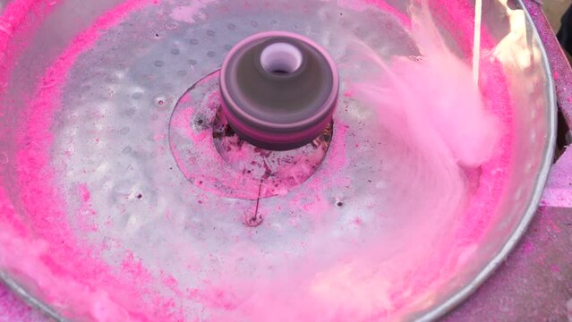 Making cotton candy or candy floss in festival, carnaval