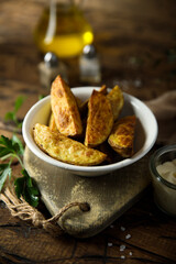 Roasted potato wedges with sauce